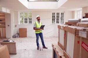 builder wearing hard hat with clipboard checking d 2021 08 30 08 39 35 utc min 300x200